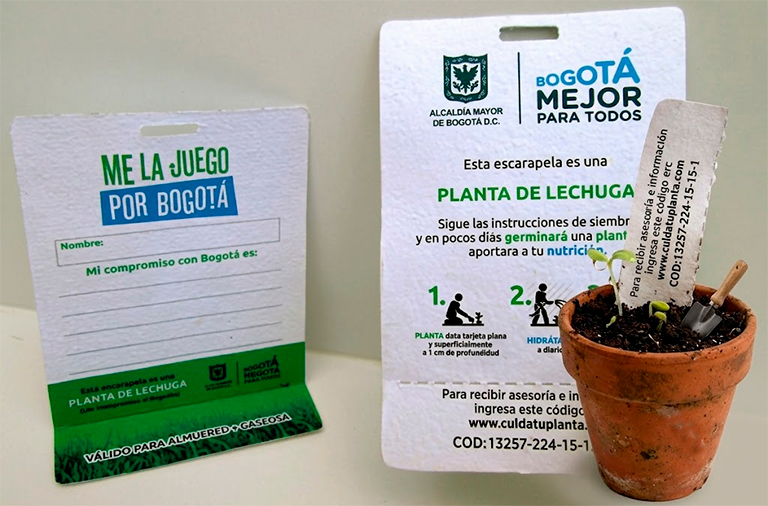 Escarapela de papel semilla personalizada para congresos y campañas ambientales.